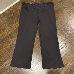 Lululemon cropped leggings with small flare and purple patterned waistband